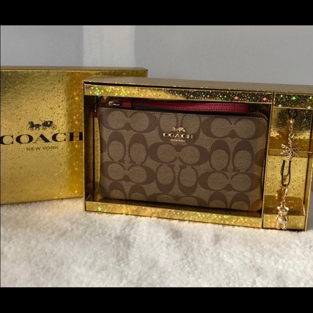 Large Coach Wristlet with charms